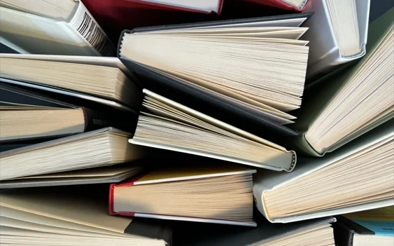 Stack of open books viewed from above