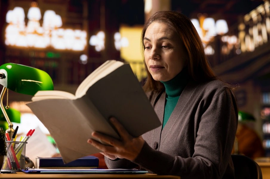 Professional exploring leadership and management books