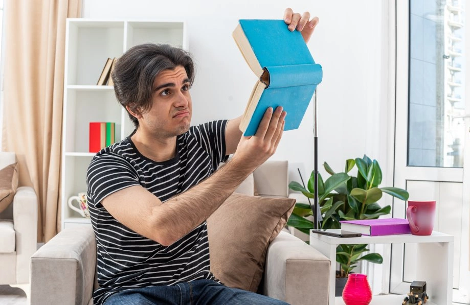 Woman organizing books and documents while preparing a book publicity plan.